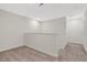 Upstairs hallway featuring carpet floors, white walls, and plenty of space at 12015 Prologue Ave, Orlando, FL 32832