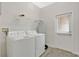 Laundry room featuring new washer, dryer, and wood tile floors at 12015 Prologue Ave, Orlando, FL 32832