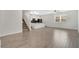 Open floorplan with sleek flooring, recessed lighting, and versatile space at 12015 Prologue Ave, Orlando, FL 32832