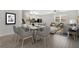 Inviting living space with sleek flooring, open floor plan, and stylish dining area at 12015 Prologue Ave, Orlando, FL 32832