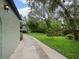 Spacious backyard featuring a stone driveway and a well-manicured lawn at 1227 Golden Ln, Orlando, FL 32804