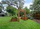 Garden featuring raised garden beds and an arched wooden entrance at 1227 Golden Ln, Orlando, FL 32804