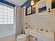 Cozy bathroom with classic fixtures, tile details, and a shower-tub combination at 1227 Golden Ln, Orlando, FL 32804