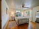 Bright bedroom with a queen-sized bed, a ceiling fan, and hardwood floors at 1227 Golden Ln, Orlando, FL 32804