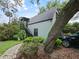 Exterior view of the home's ADU showing lush landscaping, and a private entrance at 1227 Golden Ln, Orlando, FL 32804