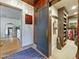Hallway featuring a sliding barn door leading to a closet, and access to a bedroom at 1227 Golden Ln, Orlando, FL 32804