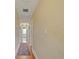Hallway with hardwood floors leads to rooms filled with natural light at 1227 Golden Ln, Orlando, FL 32804