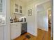 Wet bar features a wine fridge, white cabinetry, and marble countertops at 1227 Golden Ln, Orlando, FL 32804