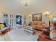 Cozy living room featuring hardwood floors, a chandelier, and stylish furniture at 1227 Golden Ln, Orlando, FL 32804
