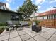 Charming patio with comfortable outdoor seating, a fire pit, and a well-maintained garden at 1227 Golden Ln, Orlando, FL 32804