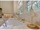 Close up of farmhouse sink with marble counter and bright windows at 1227 Golden Ln, Orlando, FL 32804
