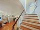 Staircase leading to the upper level of the home with hardwood steps at 1227 Golden Ln, Orlando, FL 32804