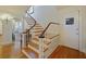 Elegant staircase with wood treads, white risers, and a stylish banister at 1227 Golden Ln, Orlando, FL 32804