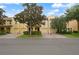 Street view of yellow townhomes with tile roofs, garages, and landscaped yards at 1277 Blessing St, Maitland, FL 32751