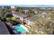 An aerial view showcasing the property's pool, mature landscaping, and proximity to nearby amenities at 145 Oyster Bay Cir # 140, Altamonte Springs, FL 32701