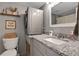 Updated bathroom with granite countertops, new washer, and modern fixtures at 145 Oyster Bay Cir # 140, Altamonte Springs, FL 32701