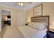 Comfortable bedroom featuring a queen bed, a ceiling fan, and an entry door at 145 Oyster Bay Cir # 140, Altamonte Springs, FL 32701