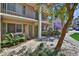 Charming condo building featuring green shutters and manicured landscaping at 145 Oyster Bay Cir # 140, Altamonte Springs, FL 32701