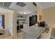 Open kitchen with granite counters and appliances, offering a practical and stylish space at 145 Oyster Bay Cir # 140, Altamonte Springs, FL 32701