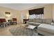 Comfortable living room with gray sofa, patterned chairs, and natural light at 145 Oyster Bay Cir # 140, Altamonte Springs, FL 32701