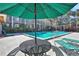 Enjoy this inviting outdoor pool with lounge seating and shade umbrellas for relaxing poolside enjoyment at 145 Oyster Bay Cir # 140, Altamonte Springs, FL 32701