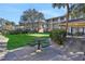 Enjoy a shared putting green space amidst lush landscaping, creating a serene outdoor experience at 145 Oyster Bay Cir # 140, Altamonte Springs, FL 32701