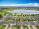 Aerial view of home near lake, showcasing nearby amenities and neighborhood layout at 1540 Orange Valley Rdg, Ocoee, FL 34761