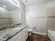 Features granite countertops, wood-look flooring, and a shower/tub combination at 1540 Orange Valley Rdg, Ocoee, FL 34761