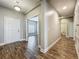 Inviting hallway with wood floors, neutral colors, and an open view throughout the home at 1540 Orange Valley Rdg, Ocoee, FL 34761