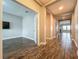 Inviting hallway featuring wood-style floors and neutral paint creating an airy feel at 1540 Orange Valley Rdg, Ocoee, FL 34761