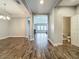 Open-concept living room flowing into dining area, great for entertaining guests at 1540 Orange Valley Rdg, Ocoee, FL 34761