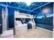 Charming bedroom featuring a bunk bed and Star Wars themed decor at 16061 Blue Wave Way, Clermont, FL 34714