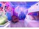 Adorable ' room featuring a bunk bed and Disney Princess-themed decor and purple lighting at 16061 Blue Wave Way, Clermont, FL 34714