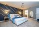 Stunning main bedroom with modern accent wall, stylish lighting, and luxurious bed at 16061 Blue Wave Way, Clermont, FL 34714