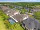 Scenic aerial view of the property showcasing the lush backyard, pool, and the surrounding neighborhood at 16120 Bristol Lake Cir, Orlando, FL 32828