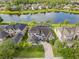 Stunning aerial view of a luxurious home on a tranquil lake at 16120 Bristol Lake Cir, Orlando, FL 32828