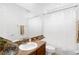 Bathroom with a spacious mirror, decorative crystal accent, and neutral wall color at 16120 Bristol Lake Cir, Orlando, FL 32828