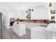 Modern white kitchen featuring stainless steel appliances, ample counter space, and an island at 16120 Bristol Lake Cir, Orlando, FL 32828