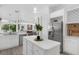 Bright kitchen featuring white cabinets, stainless steel appliances, and a center island at 16120 Bristol Lake Cir, Orlando, FL 32828