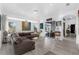 Comfortable living room with a large gray couch, bright art, and lots of natural light at 16120 Bristol Lake Cir, Orlando, FL 32828