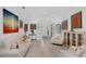 Open-concept living room with hardwood flooring and comfortable white seating at 16120 Bristol Lake Cir, Orlando, FL 32828