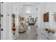 Bright living room with hardwood flooring, art, and access to the pool area at 16120 Bristol Lake Cir, Orlando, FL 32828