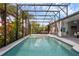 Beautiful screened-in pool with lush landscaping and an adjacent hot tub for ultimate relaxation at 16120 Bristol Lake Cir, Orlando, FL 32828