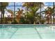 Inviting pool featuring beautiful tropical plants and a serene buddha statue at 16120 Bristol Lake Cir, Orlando, FL 32828