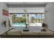 Relaxing outdoor space with comfortable seating overlooking the screened-in pool and lush landscaping at 16120 Bristol Lake Cir, Orlando, FL 32828