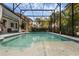 Private pool and screened-in lanai with lush greenery offering a serene outdoor experience at 16120 Bristol Lake Cir, Orlando, FL 32828