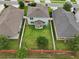 Aerial of a fenced backyard, showcasing a well-maintained lawn and outdoor living space at 16440 Centipede St, Clermont, FL 34714