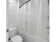 This bathroom features a white toilet and tiled shower at 16440 Centipede St, Clermont, FL 34714