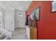 Bright foyer featuring tiled floors, staircase to second floor, white trim, and accent walls at 16440 Centipede St, Clermont, FL 34714
