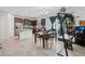 Spacious kitchen with stainless steel appliances, granite countertops, kitchen island, and an adjacent dining area at 16440 Centipede St, Clermont, FL 34714